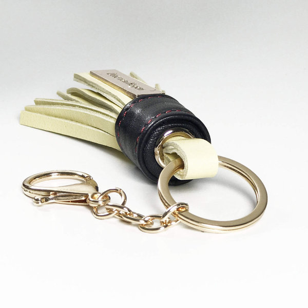 Schlüsselanhänger SERIE LUX. Leder Tassel Vanille Gelb mit Schwarzer Blende und goldfarbenen Details